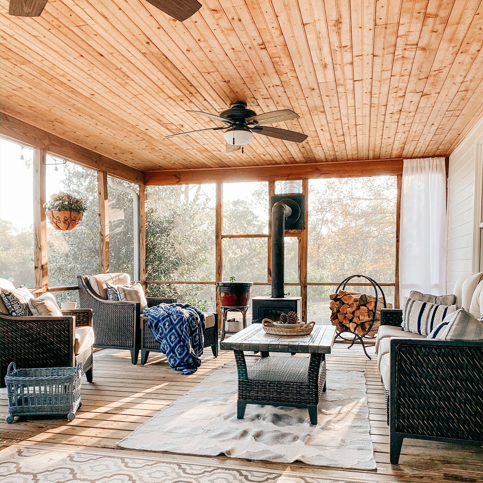 Screened porch with wood-burning stove and ceiling fan