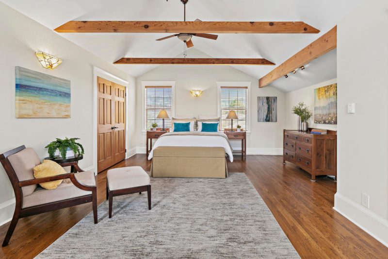 Craftsman cottage bedroom with beamed ceiling