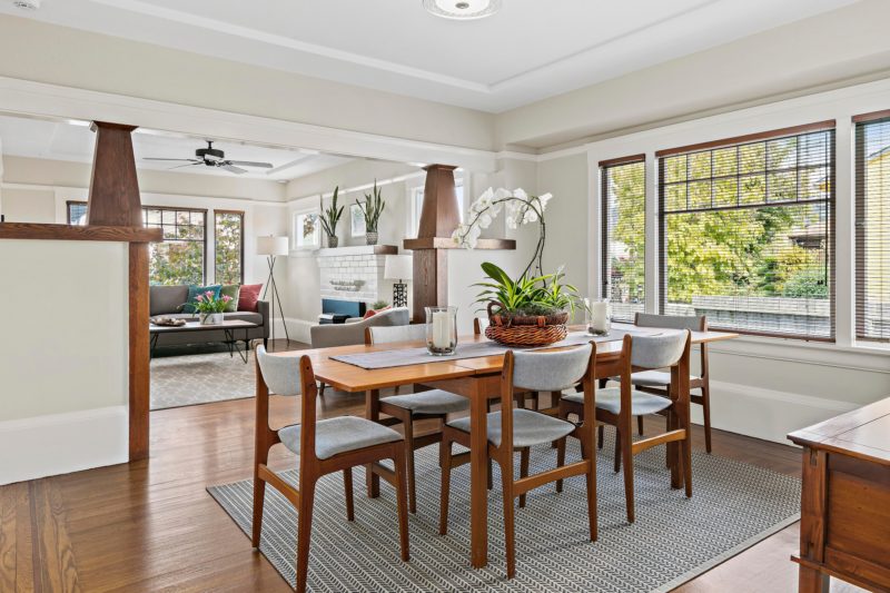 A dining room table in front of a window