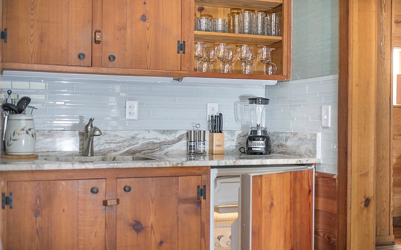 A kitchen with wood cabinets