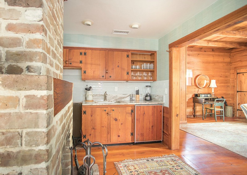 A kitchen with wooden cabinets