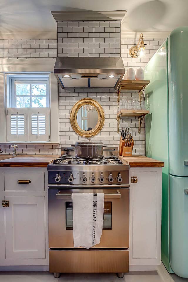 A stove top oven sitting inside of a kitchen