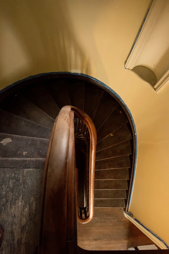 Looking down twisting staircase from upper landing