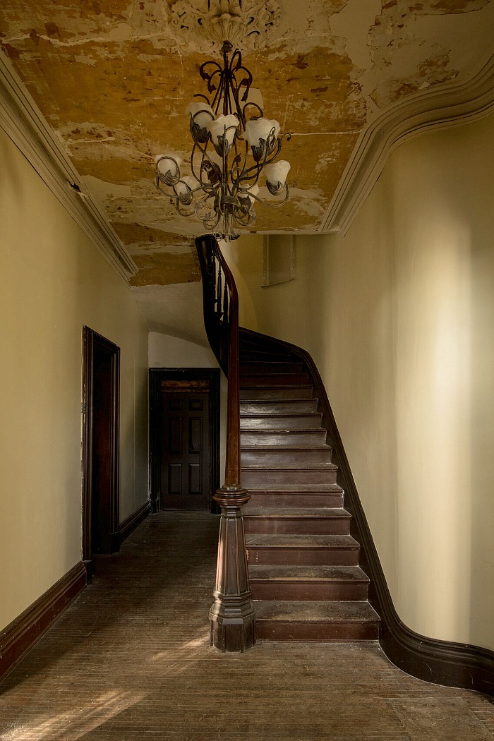 Dark wood staircase in entry hall