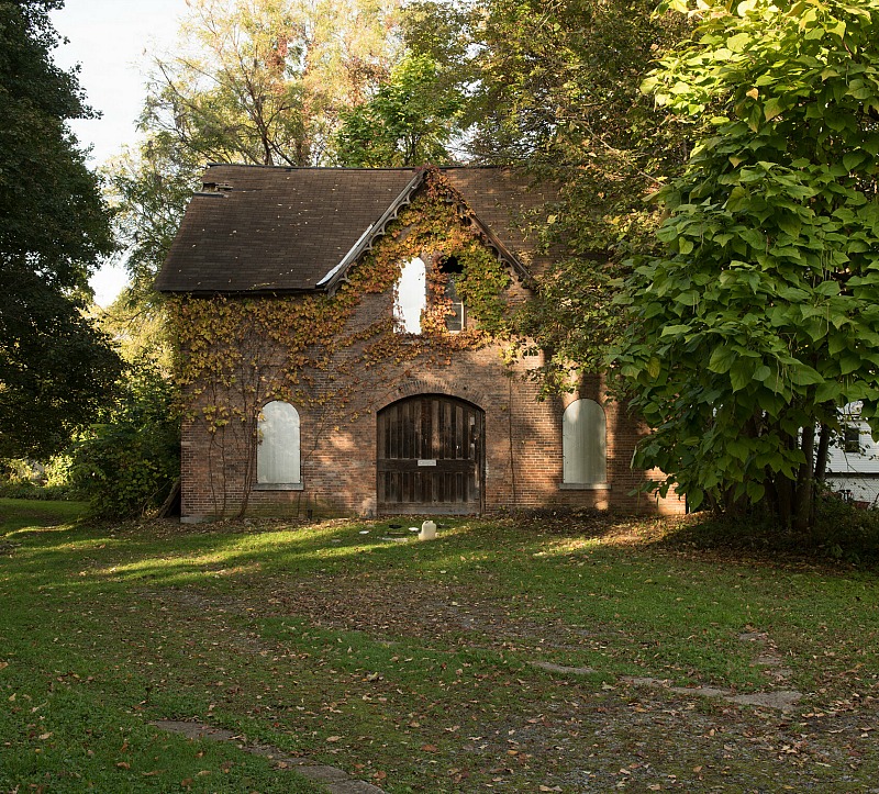 Old gate house covered in ivy