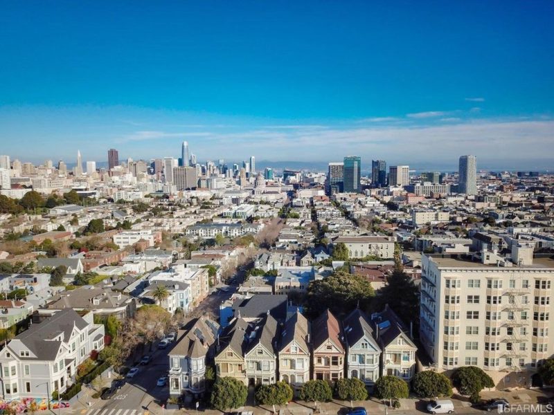 Aerial view of Steiner row of houses and city in distance