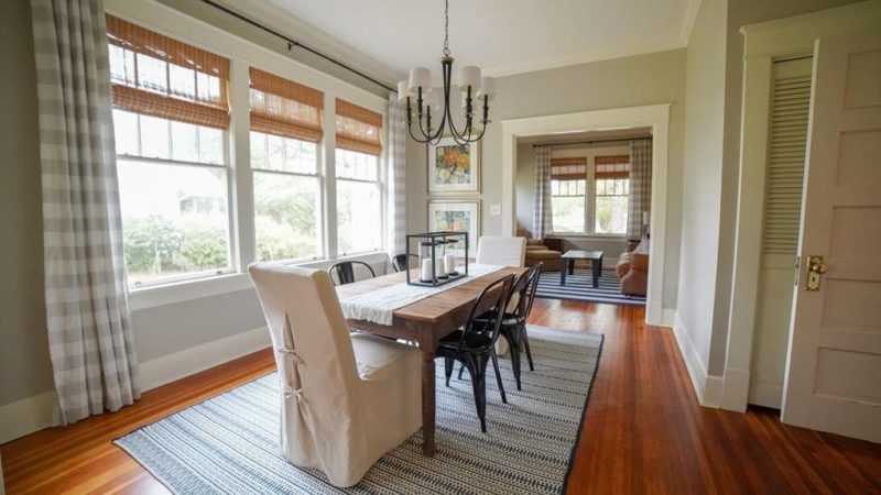 Dining room table on striped rug