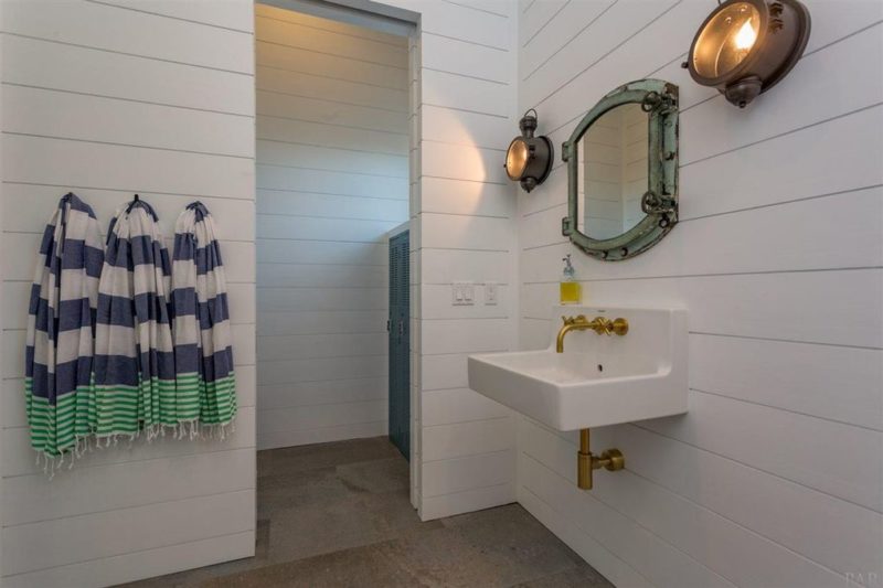 Bathroom with shiplap walls and sink