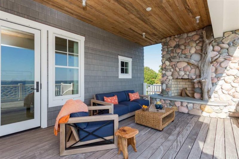 Second-story deck with stone fireplace