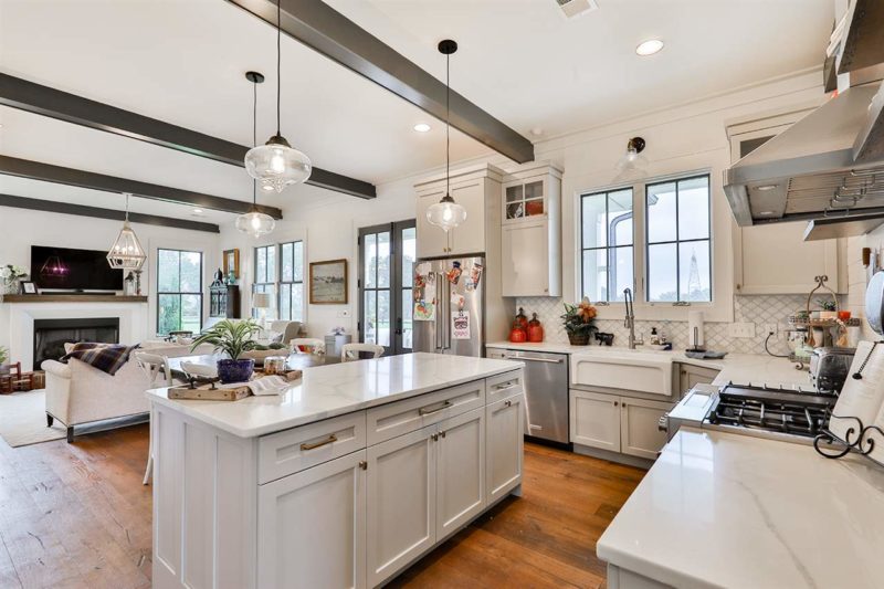 A kitchen with an island in the middle of a room