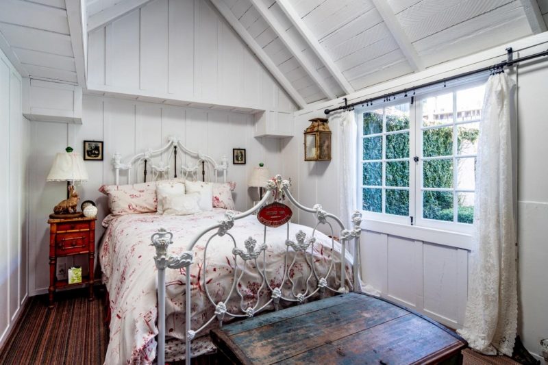 small cottage bedroom with vaulted ceiling