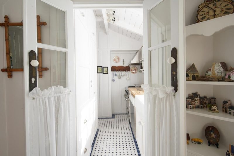 small white kitchen in cottage