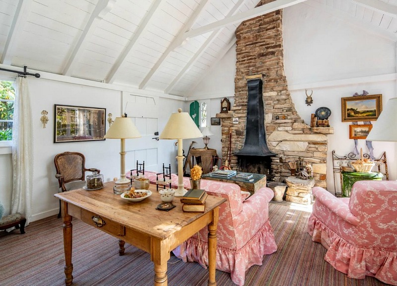 cottage living room with stone fireplace