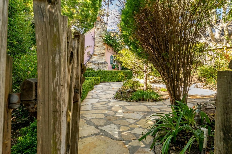 garden gate leading to pink cottage in Carmel