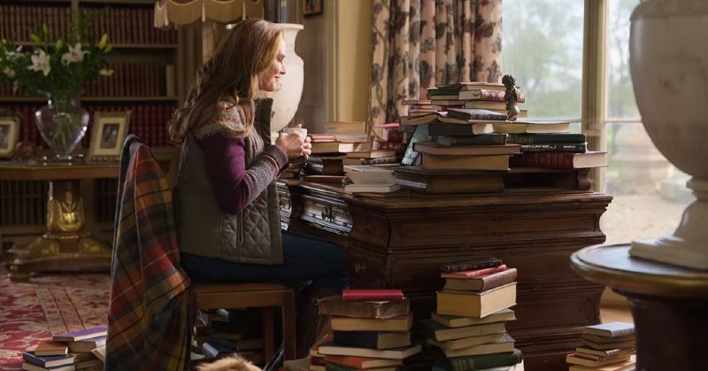 Sophie Brown writing in castle library