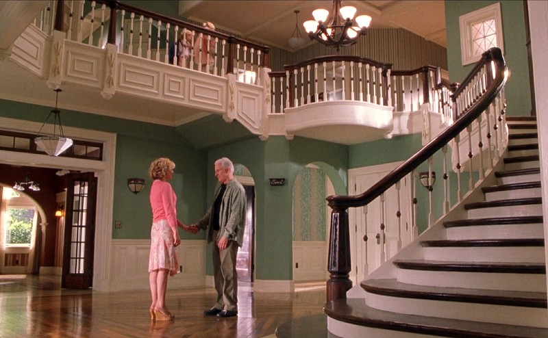 Bonnie Hunt Steve Martin standing in entry hall of house