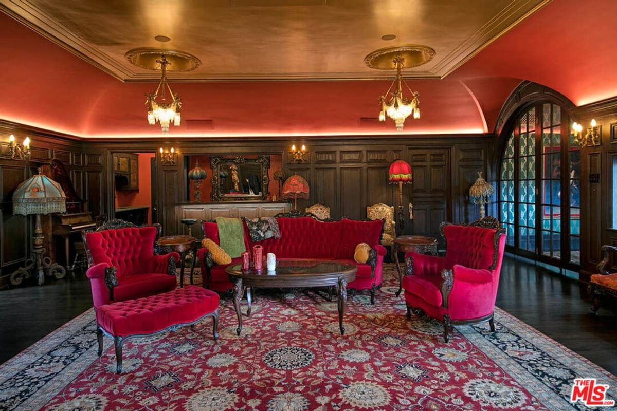 red velvet settee and chairs in third floor of house