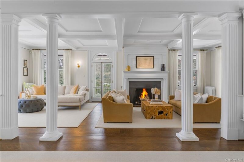 living area with fireplace inside Victorian mansion Glenholme